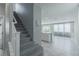 Entryway featuring carpet stairs and tile flooring leading into the living area at 4589 Swimming Minnow Ave, Las Vegas, NV 89141