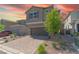 Attractive two-story house with a paved driveway and low-maintenance desert landscape at 4589 Swimming Minnow Ave, Las Vegas, NV 89141
