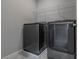 Functional laundry room with new washer and dryer units, plus convenient shelving at 4589 Swimming Minnow Ave, Las Vegas, NV 89141