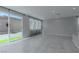 Open concept living space with tile floors, natural light, and sliding glass doors leading to outdoor patio at 4589 Swimming Minnow Ave, Las Vegas, NV 89141