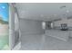 Bright living area with tile flooring, open to the kitchen, and featuring a sliding door to the backyard at 4589 Swimming Minnow Ave, Las Vegas, NV 89141