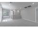 Upstairs loft area with neutral carpet, showcasing natural light and access to multiple rooms at 4589 Swimming Minnow Ave, Las Vegas, NV 89141