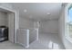 Open loft area with carpeted floors and a doorway to the laundry room at 4589 Swimming Minnow Ave, Las Vegas, NV 89141