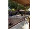 Backyard with a shade tree and a gravel patio at 5020 Wildroot Rd, Las Vegas, NV 89130