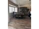 Dining room with wood-look floors, plantation shutters, and furniture at 5020 Wildroot Rd, Las Vegas, NV 89130
