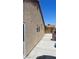 Exterior home view featuring stucco siding and a concrete walkway at 5020 Wildroot Rd, Las Vegas, NV 89130