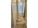 Hallway with wood flooring, closet and open bathroom view at 5020 Wildroot Rd, Las Vegas, NV 89130
