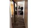 Hallway with wood flooring, sliding closet doors, and a sitting area at 5020 Wildroot Rd, Las Vegas, NV 89130