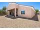 A view of the backyard featuring desert landscaping and a covered patio at 5120 Mirage Garden St, Las Vegas, NV 89130