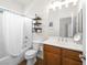 Bathroom with a single sink vanity and a shower and tub combination at 5120 Mirage Garden St, Las Vegas, NV 89130