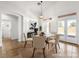 Cozy breakfast nook featuring French doors and a stylish light fixture at 5120 Mirage Garden St, Las Vegas, NV 89130