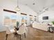 Dining area featuring vaulted ceilings, modern lighting, and a view of the backyard at 5120 Mirage Garden St, Las Vegas, NV 89130