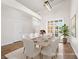 Bright dining room with a large window and modern lighting fixture at 5120 Mirage Garden St, Las Vegas, NV 89130