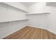 Empty walk-in closet featuring vinyl flooring and white walls with shelving at 5120 Mirage Garden St, Las Vegas, NV 89130