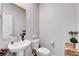 Half bathroom with a pedestal sink, decorative furnishings, and a bright interior at 5236 Sunstone Mesa Dr, Las Vegas, NV 89166