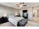 Relaxing bedroom retreat featuring neutral tones, soft carpet, ceiling fan, and a comfortable queen bed at 5236 Sunstone Mesa Dr, Las Vegas, NV 89166