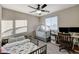 Bright bedroom with a crib, a toddler bed, and a desk at 5236 Sunstone Mesa Dr, Las Vegas, NV 89166