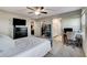 Bright bedroom with a closet and a workspace featuring a desk and chair next to the bed at 5236 Sunstone Mesa Dr, Las Vegas, NV 89166