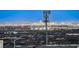 Night shot of a vibrant city skyline with a large communications tower in the foreground at 5236 Sunstone Mesa Dr, Las Vegas, NV 89166