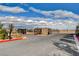 Gated community entrance with desert landscaping, a mountain view, and a secure, welcoming entry point at 5236 Sunstone Mesa Dr, Las Vegas, NV 89166