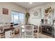 Dining area features natural light, a coffee bar, and whimsical decor at 5236 Sunstone Mesa Dr, Las Vegas, NV 89166