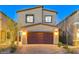 Charming two-story home with a well-maintained exterior and a brick driveway at 5236 Sunstone Mesa Dr, Las Vegas, NV 89166