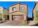 Attractive two-story home with a two-car garage and paved driveway, set in a residential neighborhood at 5236 Sunstone Mesa Dr, Las Vegas, NV 89166