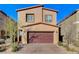 Charming two-story house with a brick driveway and a two-car garage, showcasing curb appeal at 5236 Sunstone Mesa Dr, Las Vegas, NV 89166