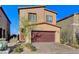 Inviting two-story home with a well-manicured front yard and a spacious two-car garage at 5236 Sunstone Mesa Dr, Las Vegas, NV 89166