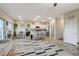 Open-concept kitchen with stainless steel appliances, a breakfast bar, and a dining area at 5236 Sunstone Mesa Dr, Las Vegas, NV 89166