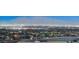 An attractive lit-up nighttime skyline is set before a hazy mountain range in the distance at 5236 Sunstone Mesa Dr, Las Vegas, NV 89166