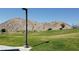 Lush green park area features a mountain backdrop and open spaces for recreation at 5236 Sunstone Mesa Dr, Las Vegas, NV 89166