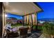Inviting covered patio with comfortable seating, perfect for enjoying the outdoors and scenic views at 5236 Sunstone Mesa Dr, Las Vegas, NV 89166