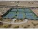 Aerial view of the tennis courts, a great amenity, in a desert landscape at 5236 Sunstone Mesa Dr, Las Vegas, NV 89166
