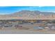 Scenic view overlooking rooftops with a mountain backdrop at 5236 Sunstone Mesa Dr, Las Vegas, NV 89166