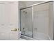 Bathroom featuring shower and tub combo with sliding glass door at 532 Greenbriar Pl, Boulder City, NV 89005