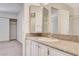Bright bathroom with a large mirror, vanity, and walk in shower at 532 Greenbriar Pl, Boulder City, NV 89005