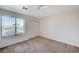 Cozy bedroom features a large window and a spacious closet at 532 Greenbriar Pl, Boulder City, NV 89005