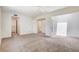Spacious primary bedroom showing access to the connected en suite bathroom and the bedroom's closet at 532 Greenbriar Pl, Boulder City, NV 89005