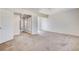 Bedroom with neutral carpet featuring open doors leading to another room at 532 Greenbriar Pl, Boulder City, NV 89005