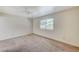 Bright bedroom features neutral walls, carpet, and natural light from the window at 532 Greenbriar Pl, Boulder City, NV 89005