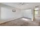 Bedroom with carpeted floors, white walls and ceiling fan at 532 Greenbriar Pl, Boulder City, NV 89005