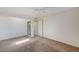 Bedroom with carpet, white walls, and a door leading to another room at 532 Greenbriar Pl, Boulder City, NV 89005
