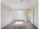 Bedroom featuring a ceiling fan, carpeted floors, and access to other rooms at 532 Greenbriar Pl, Boulder City, NV 89005