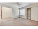 Spacious bedroom offers a closet, large window and access to the adjoined bathroom at 532 Greenbriar Pl, Boulder City, NV 89005
