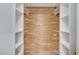 Walk-in closet with custom wood paneling and open shelving at 532 Greenbriar Pl, Boulder City, NV 89005
