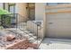Charming walkway with stairs leading up to the front door and attached two-car garage at 532 Greenbriar Pl, Boulder City, NV 89005