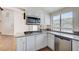 Bright kitchen features white cabinetry, stainless steel appliances, and a granite countertop at 532 Greenbriar Pl, Boulder City, NV 89005