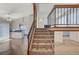 Spacious living room with stairs leading to the second floor and ample natural light at 532 Greenbriar Pl, Boulder City, NV 89005