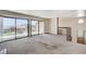 Bright living room with neutral carpet, large sliding doors with beautiful views at 532 Greenbriar Pl, Boulder City, NV 89005